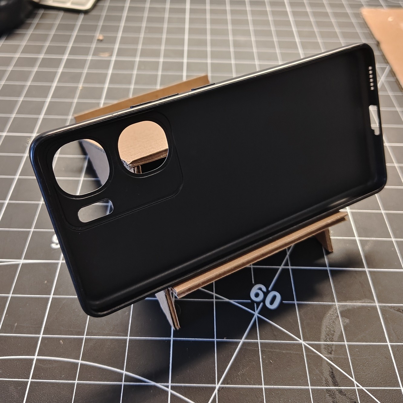 On this side, the stand only works when I put the phone horizontally. It would slide down if I put it vertically. I think I would have to add another side inside to keep it from sliding. 